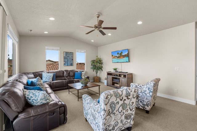 Loft lounge with sectional sofa and patterned armchairs