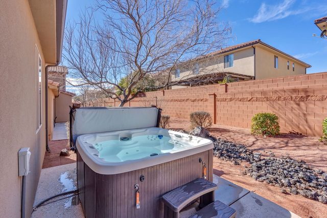 Private hot tub with steps in the side yard