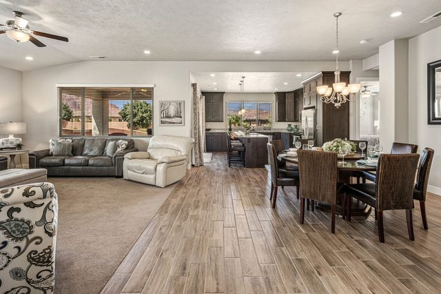 Great room with sectional sofas and dining area beyond