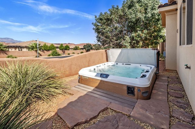 Private hot tub in the side yard with mountain view
