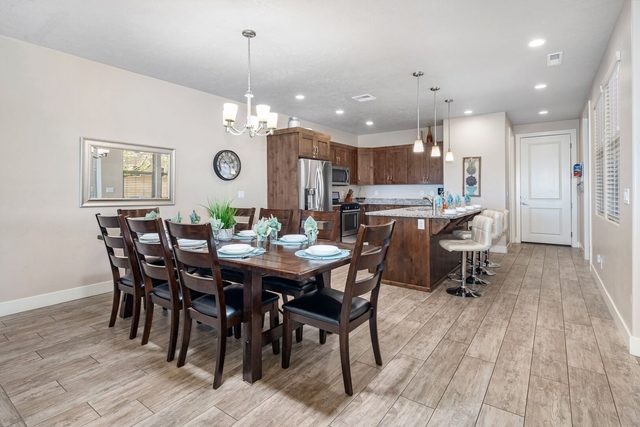 Dining table for eight opening to the kitchen island