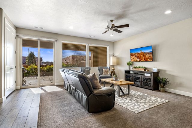Living room with sliding door to the covered back patio