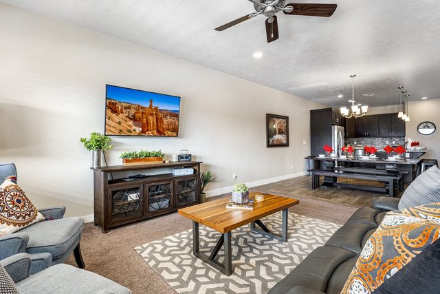 Open living area flowing into the dining room and kitchen
