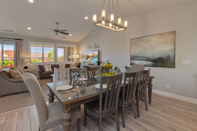Dining table for eight under chandelier at Paradise Village 86