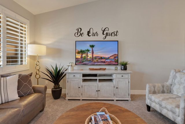 Living room TV console with sofa and accent chair