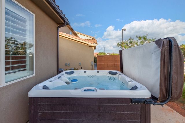 Private hot tub with cover lifted at Paradise Village 86