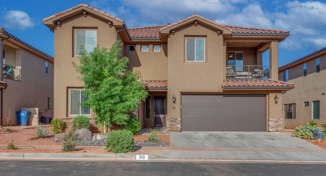 Front of home 96 with two-car garage at Paradise Village 94/96 Retreat