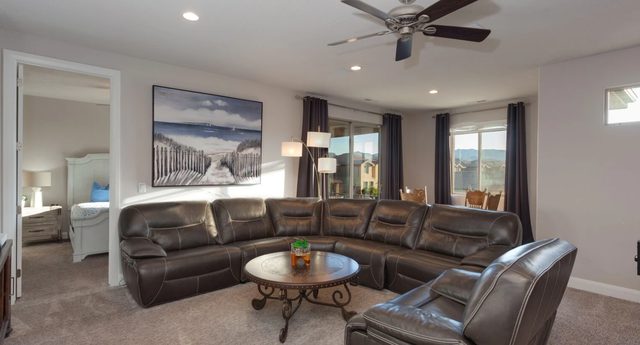 Home 96 loft with leather sectional and round coffee table