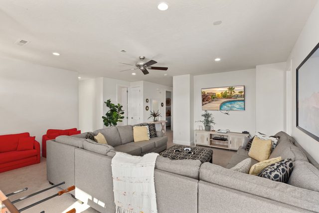 Upstairs living room with sectional sofa and smart TV