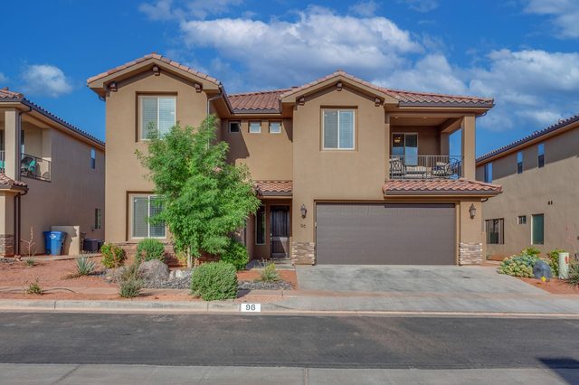 Two-story front exterior and two-car garage of Paradise Village 96