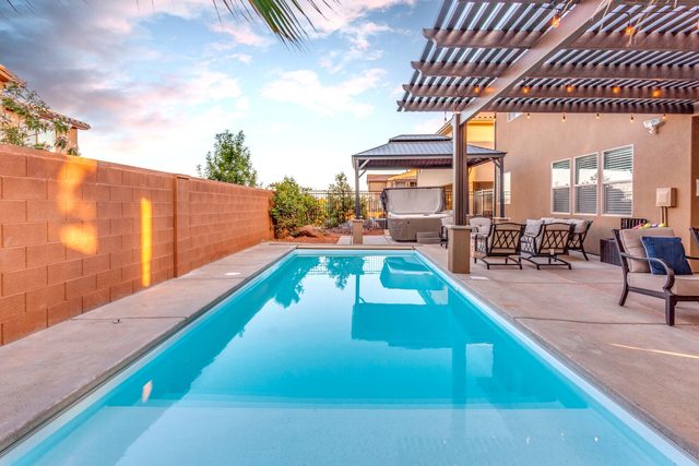 Long private pool along a red block wall