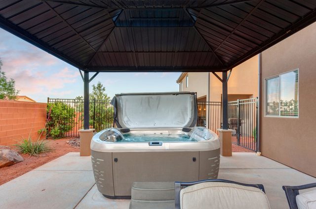 Covered private hot tub in the side yard