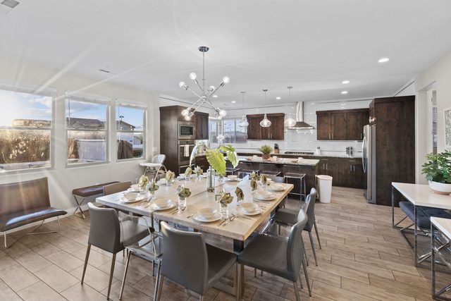Large dining table and open kitchen at Paradise Village 97