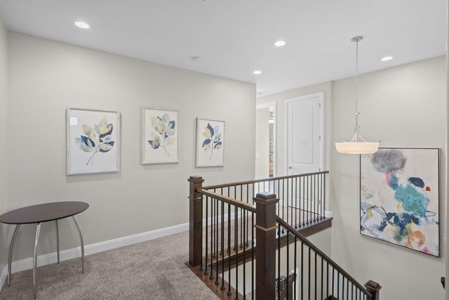 Upstairs landing with stair railing and artwork at Paradise Village 97