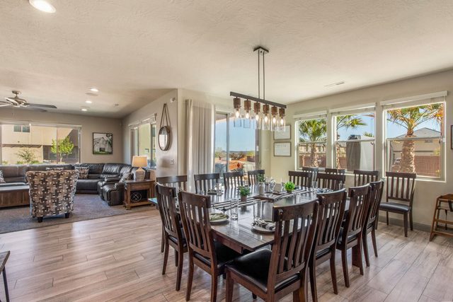 Dining room with extra-large table and seating next to the living room
