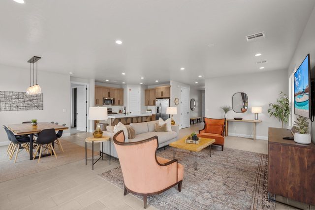Open great room with living area, dining and kitchen at Paseos 1101