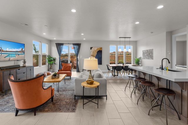 Great room with living area and kitchen island seating at Paseos 1101