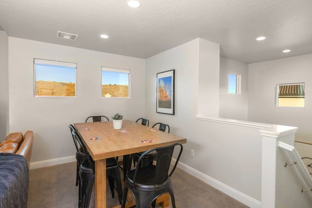 Upstairs loft with game table and seating at Paseos 1101