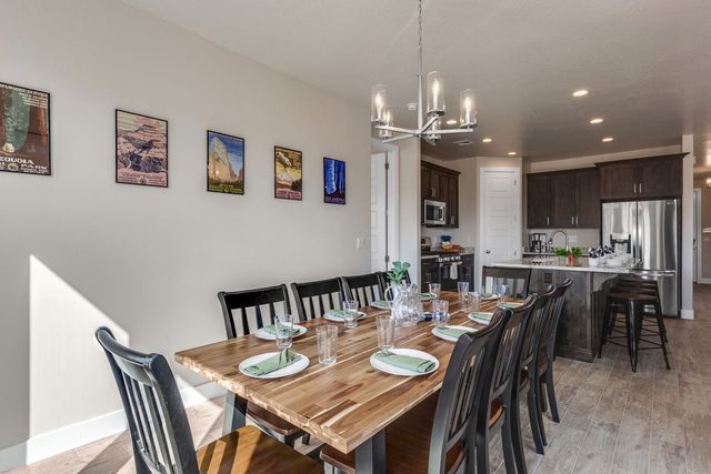 Long wood dining table beside the open kitchen at Paseos 1121