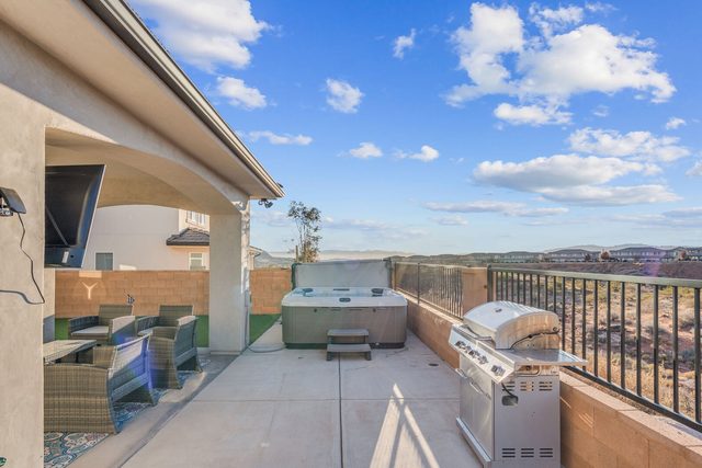 Private hot tub, grill and patio seating with desert views at Paseos 1121