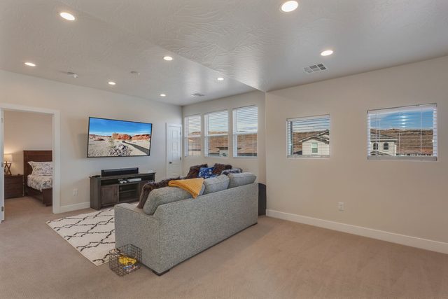 Upstairs loft lounge with sofas and windows on two sides