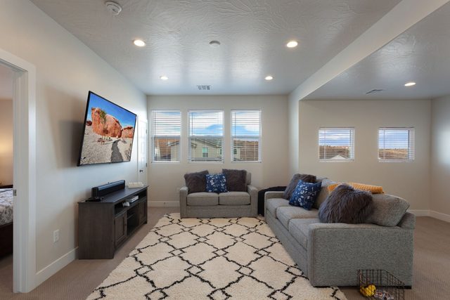 Loft sitting area with gray sofas at Paseos 1121