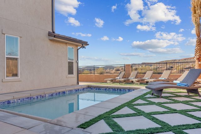 Private pool with artificial turf pavers and loungers at Paseos 1121