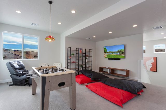 Upstairs loft with foosball table, massage chair and large bean bags
