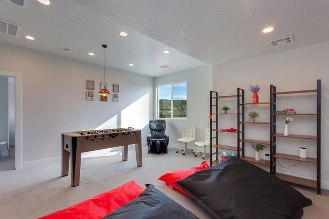 Loft game area with foosball table, shelving and massage chair