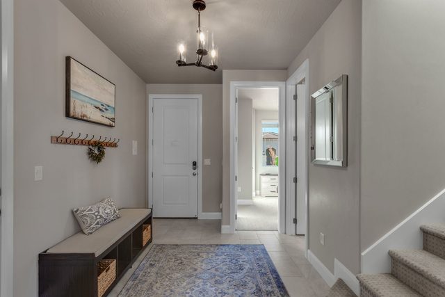 Front entry with bench, coat hooks and staircase
