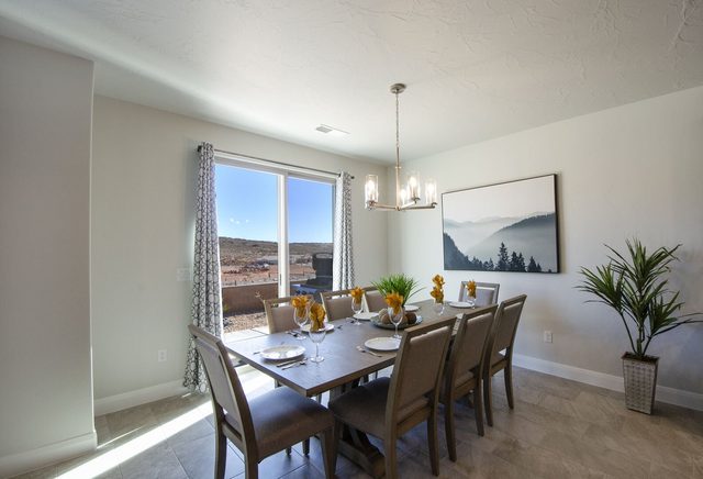Dining table for eight beside a large window