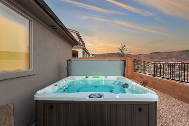 Private hot tub at sunset with desert backdrop