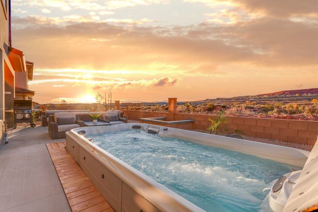 Private swim spa on the back patio at sunset