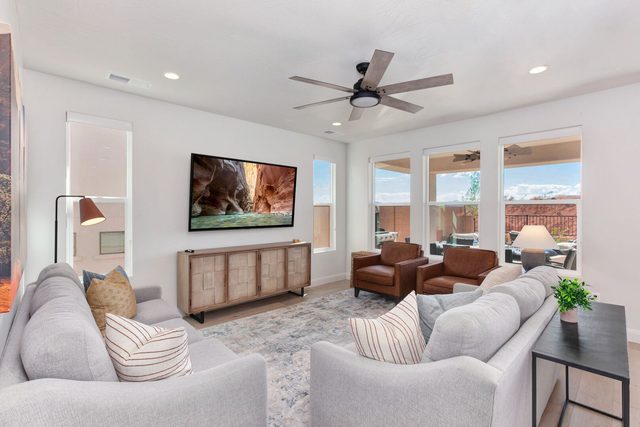 Bright living room with sectional seating and large windows