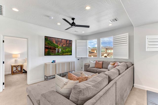 Upstairs loft lounge with sectional sofa and large smart TV
