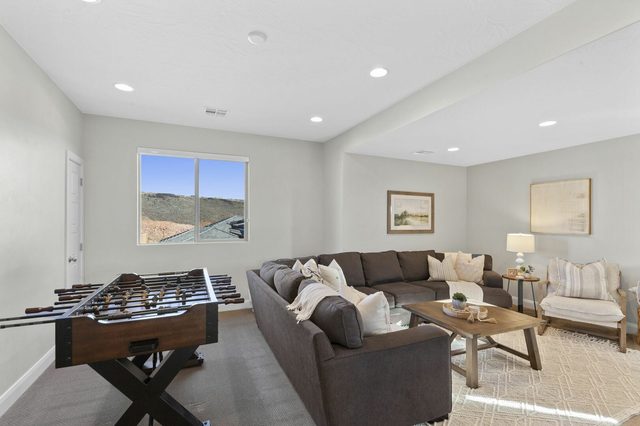 Loft lounge with foosball table and sectional seating at Paseos 1249
