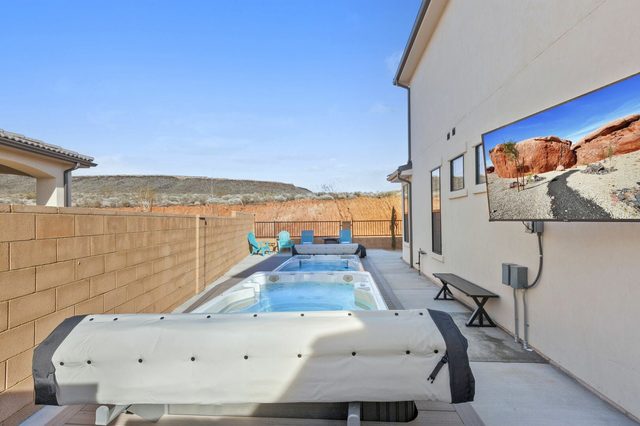 Swim spa lane with bench and outdoor TV at Paseos 1308
