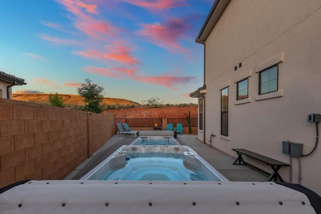 Heated swim spa along the side yard at sunset at Paseos 1308