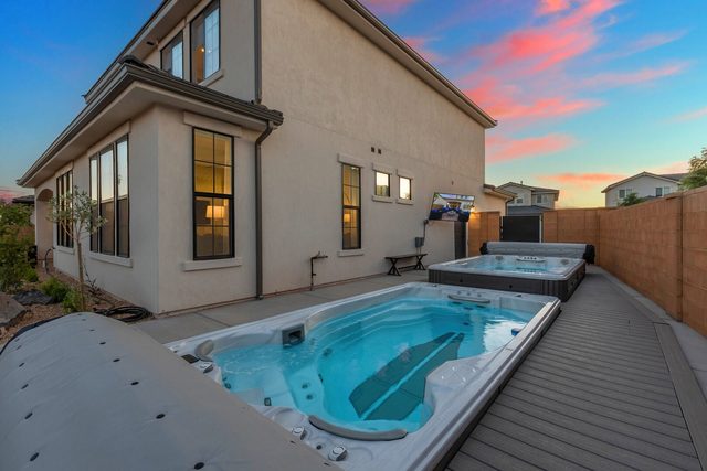 Swim spa and hot tub beside the house at dusk at Paseos 1308
