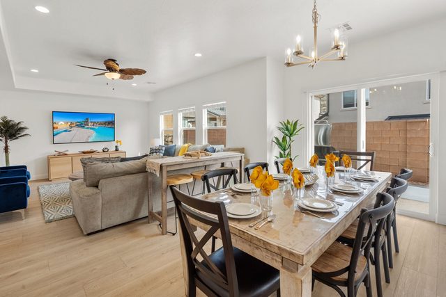 Dining table set for ten beside the living room
