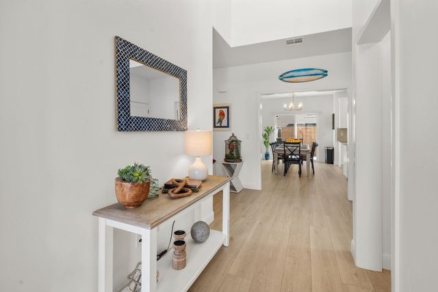 Entry hall with console table looking toward dining area