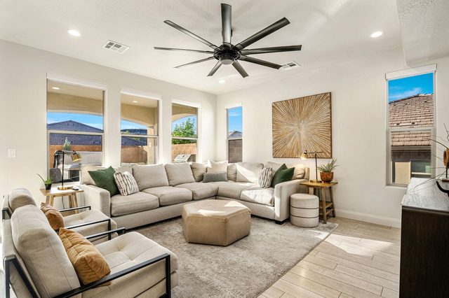 Living room with large sectional sofa and leather ottoman