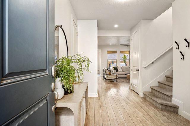 Front entry with console table and staircase