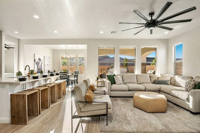 Great room with sectional, kitchen island seating and dining area