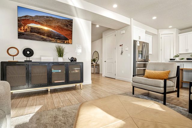 Living room TV console with view toward the kitchen