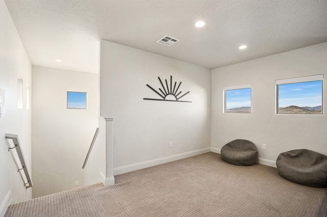 Upstairs loft with bean bag chairs near the stairs