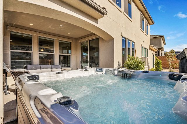Bubbling private hot tub next to the house