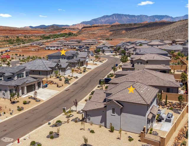 Aerial of the two neighboring homes across the street in Paseos