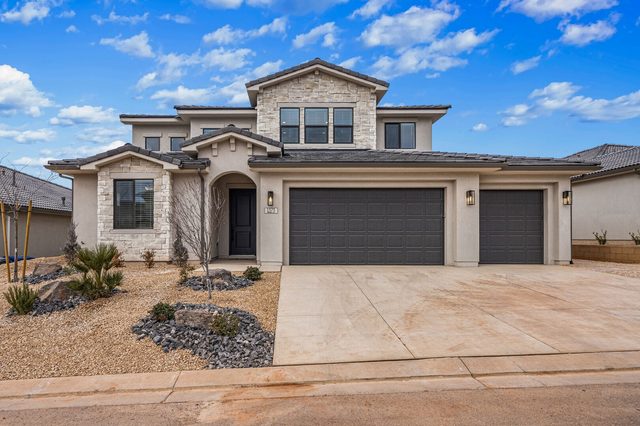 Paseos 1373 front exterior with stone accents and three-car garage
