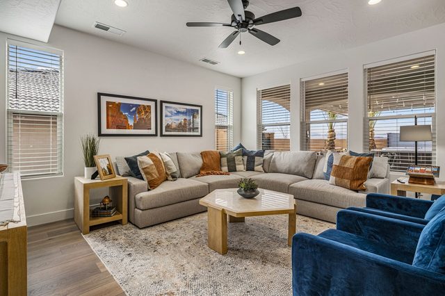 Paseos 1373 living room with large sectional and blue armchairs